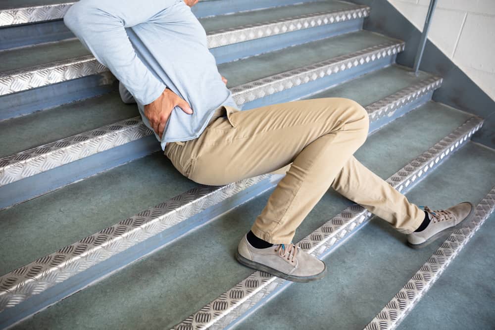 Mature Man Lying On Staircase